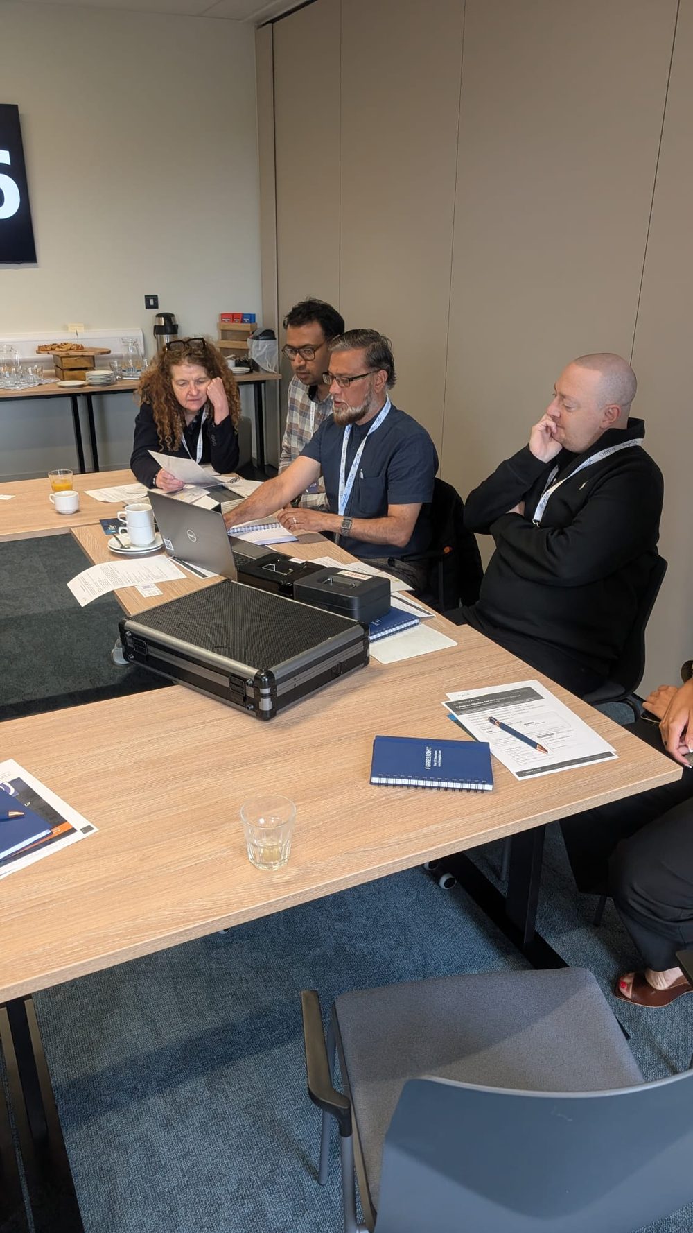 Delegates collaborating on the tabletop cyber exercise