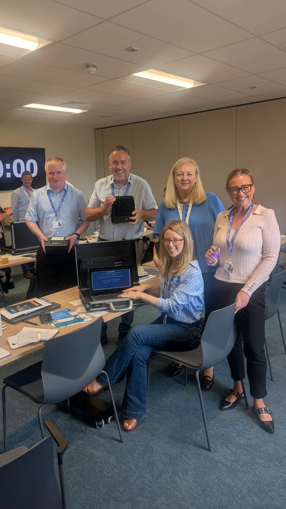 The winning team celebrating after completing the cyber escape room